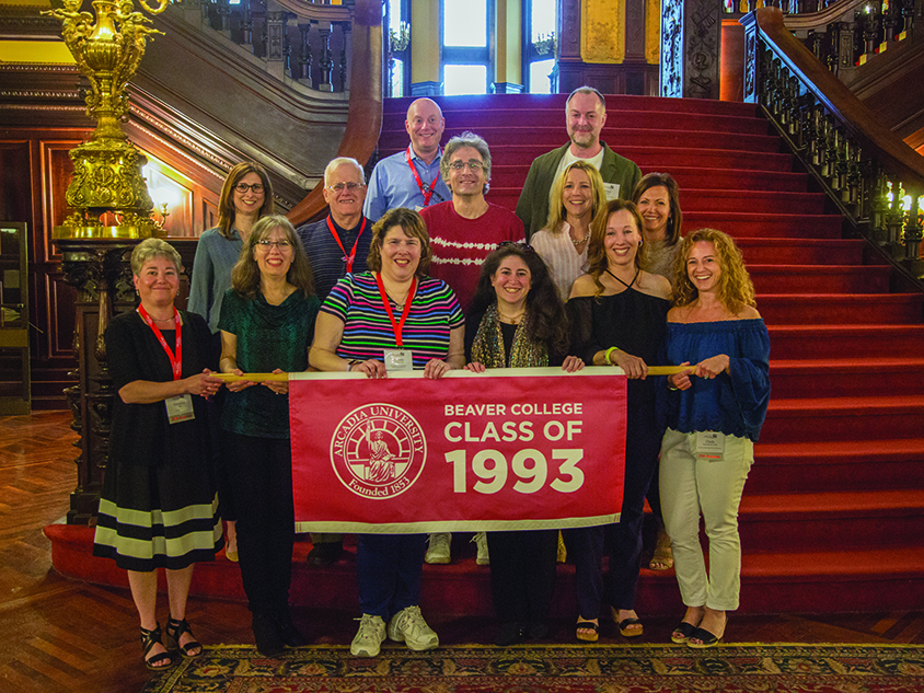 A group of alumni holding a Beaver College Class of 1993 banner.
