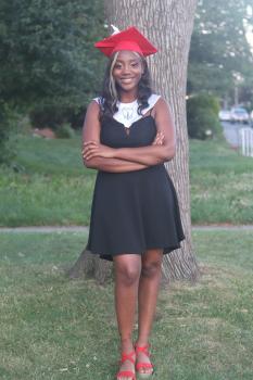 Graduation photo of Arcadia University student Amani Harris in cap and gown.