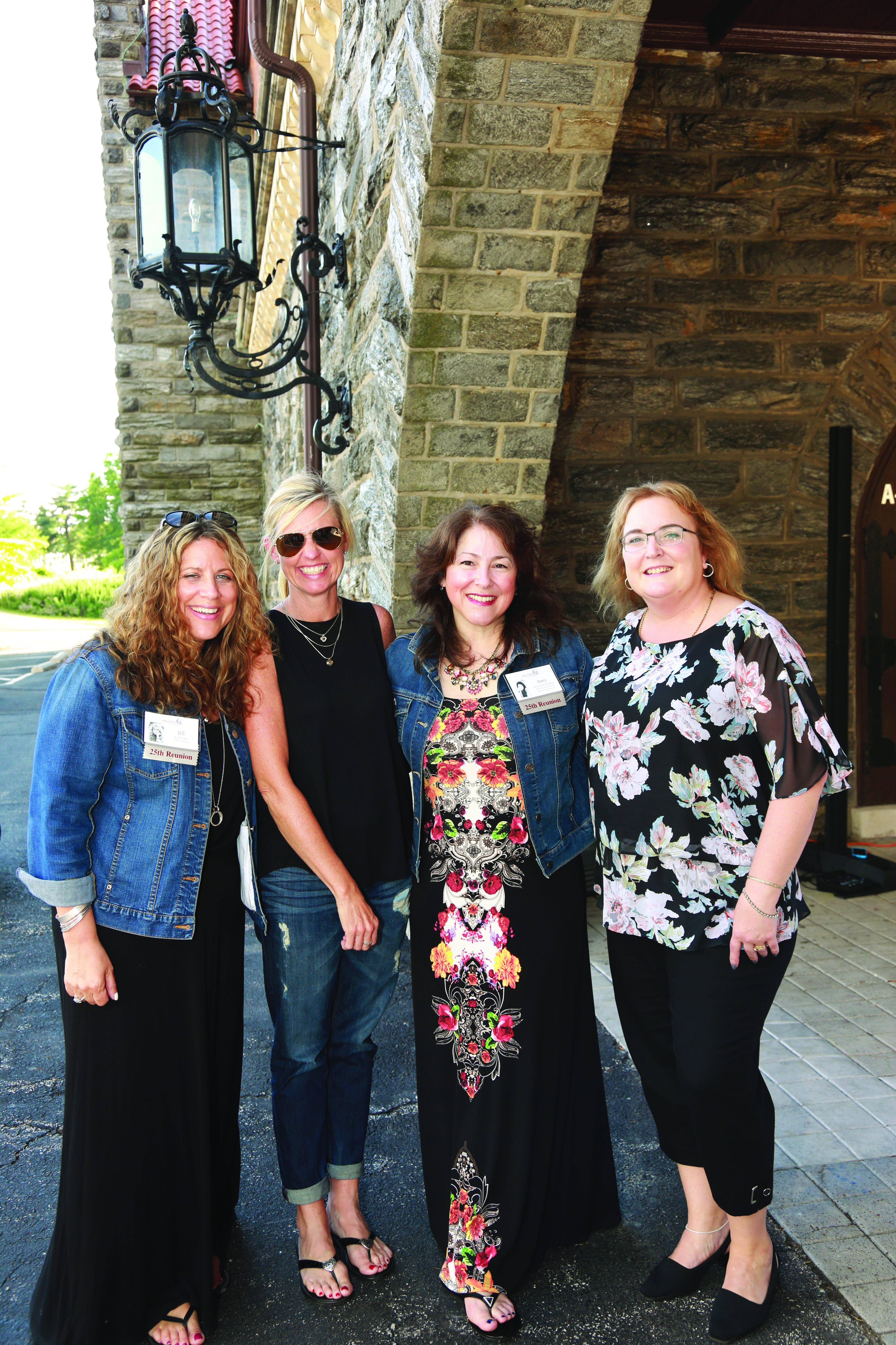 Jill Buchbinder, Suzi Beaver Meanor, Amy Richardson MacMath, and Marianne King Pedicone posing together and representing Class of 1990.