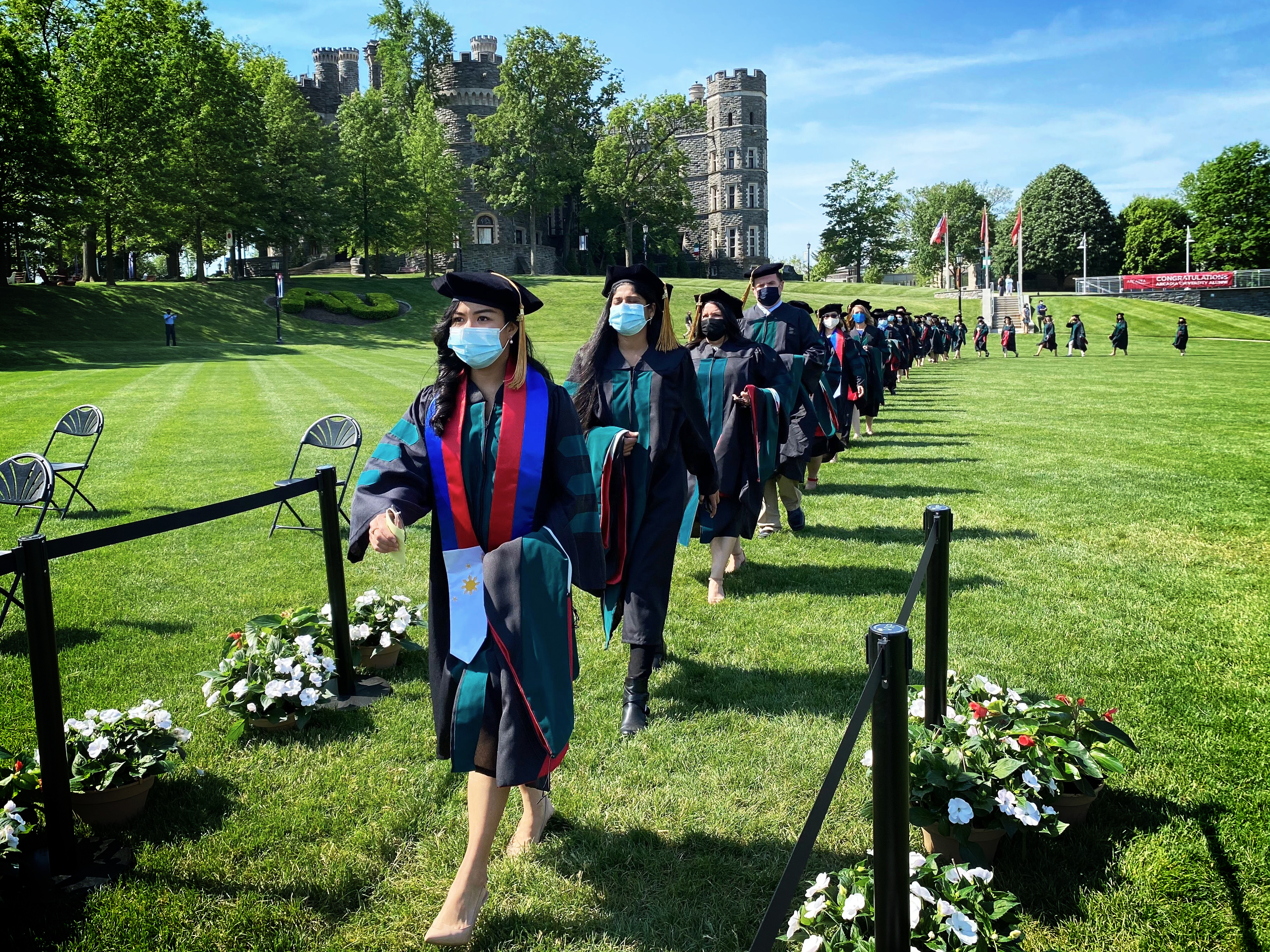 A line of graduating Doctorate students walking down to their ceremony.