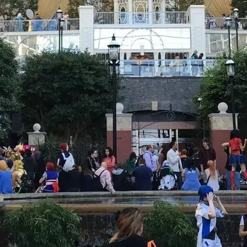 People cosplaying outside during a convention.