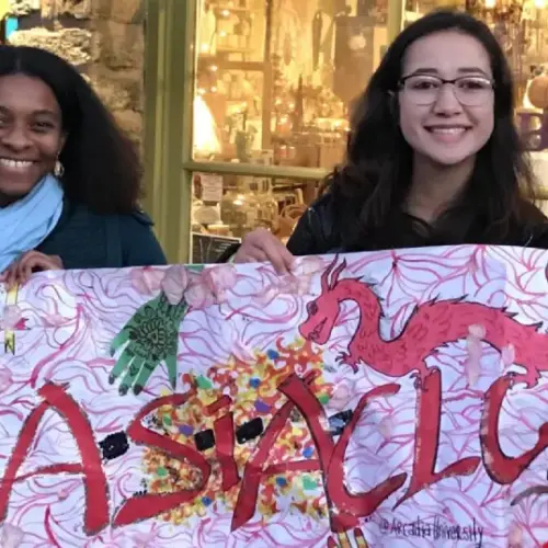 Students holding a poster celebrating Asian culture