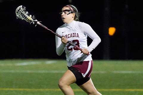 Arcadia women's lacrosse player on the field