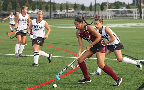 An Arcadia field hockey player handles the ball during a game against Stockton