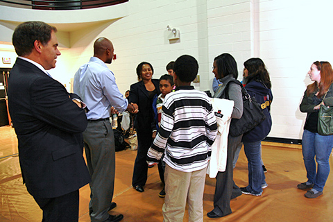 A group of students talking to the presenter.