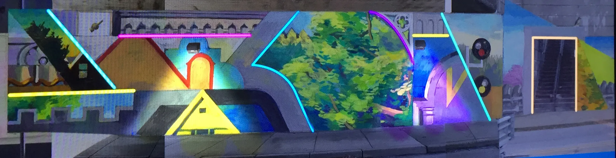 The Glenside Mural is lit up by LED lighting in the evening