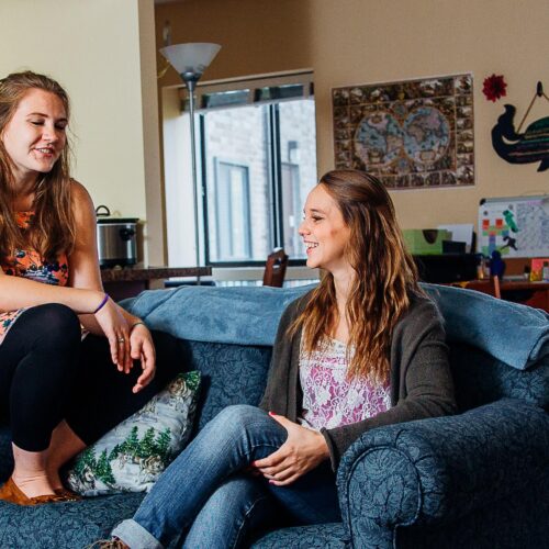 Two students talking to each other in an Oak Summit apartment.