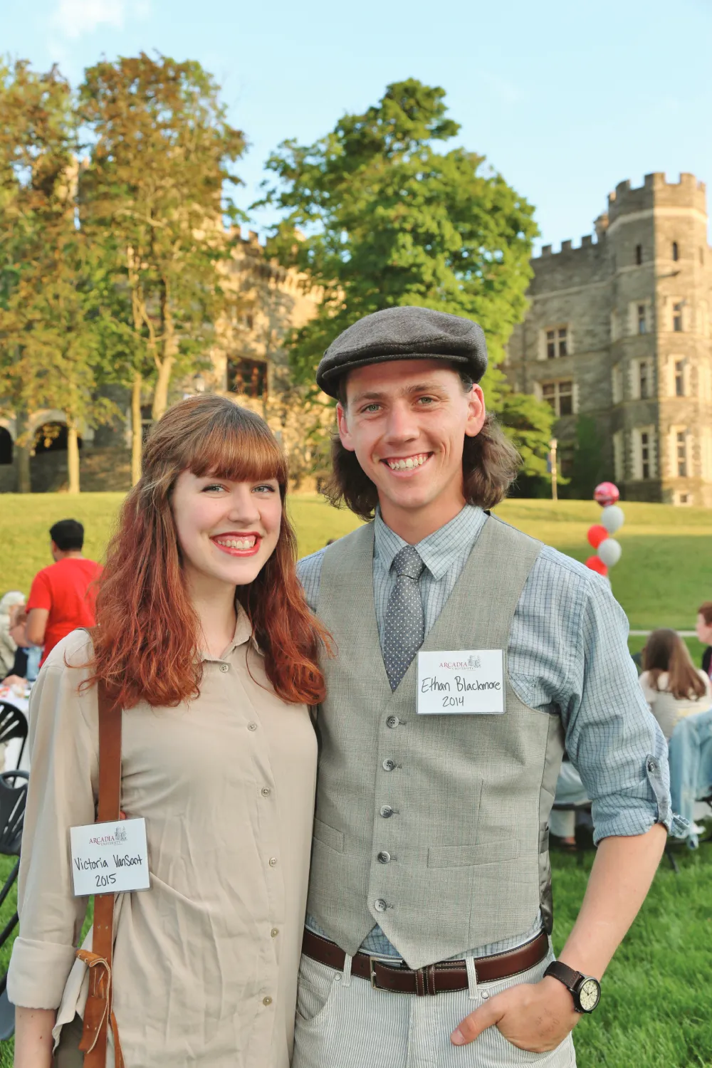 Two alumni students posing together on Haber Green