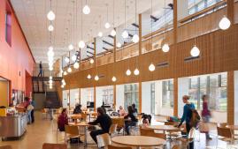 Students eat in a campus dining hall area.