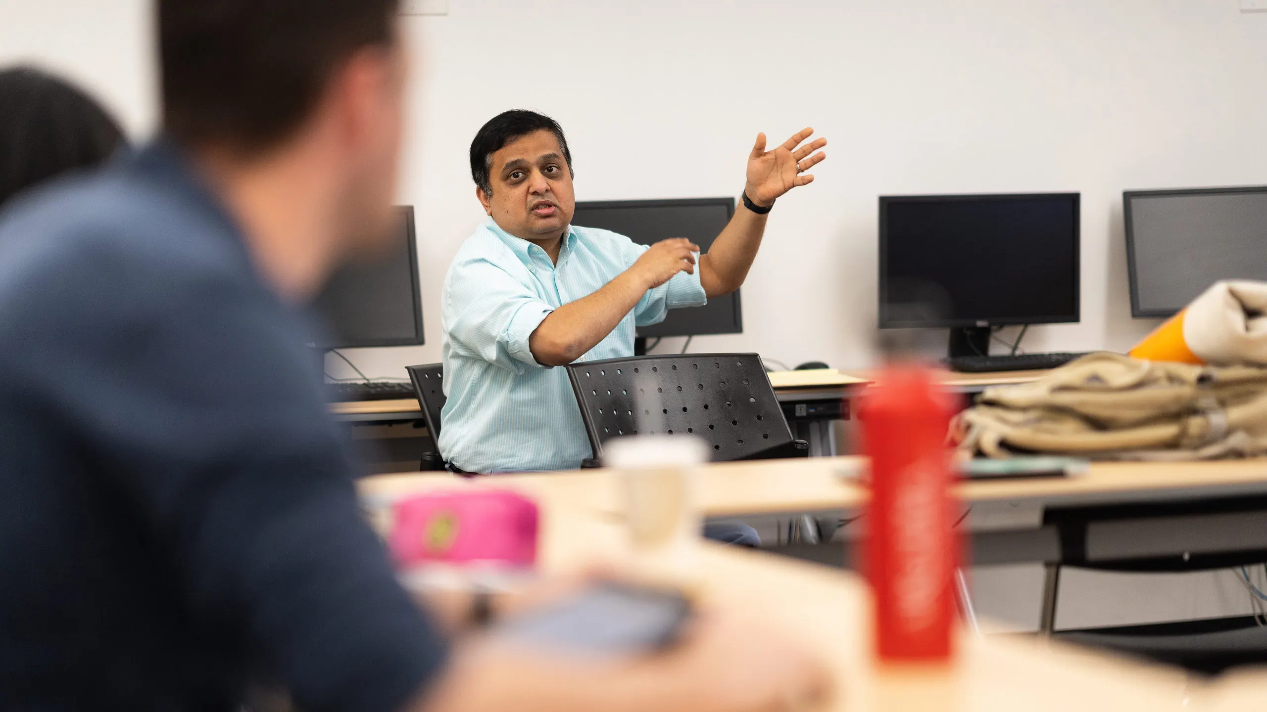 Professor Raghu Kurthakoti teaches a marketing class.