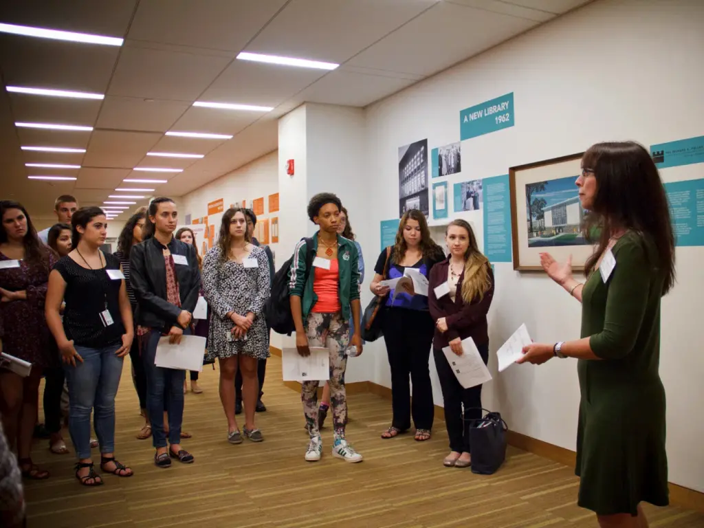 Group of honors students stand together and participate in a mentoring event.