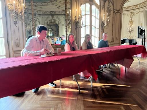 Actuarial Science alumni panel lined up at a table giving a presentation