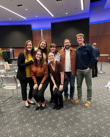 PA students smiling as they pose in an auditorium.