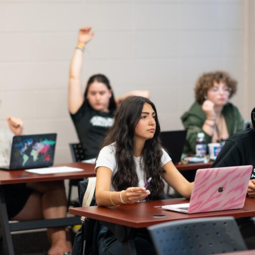 Students sitting in a classroom.