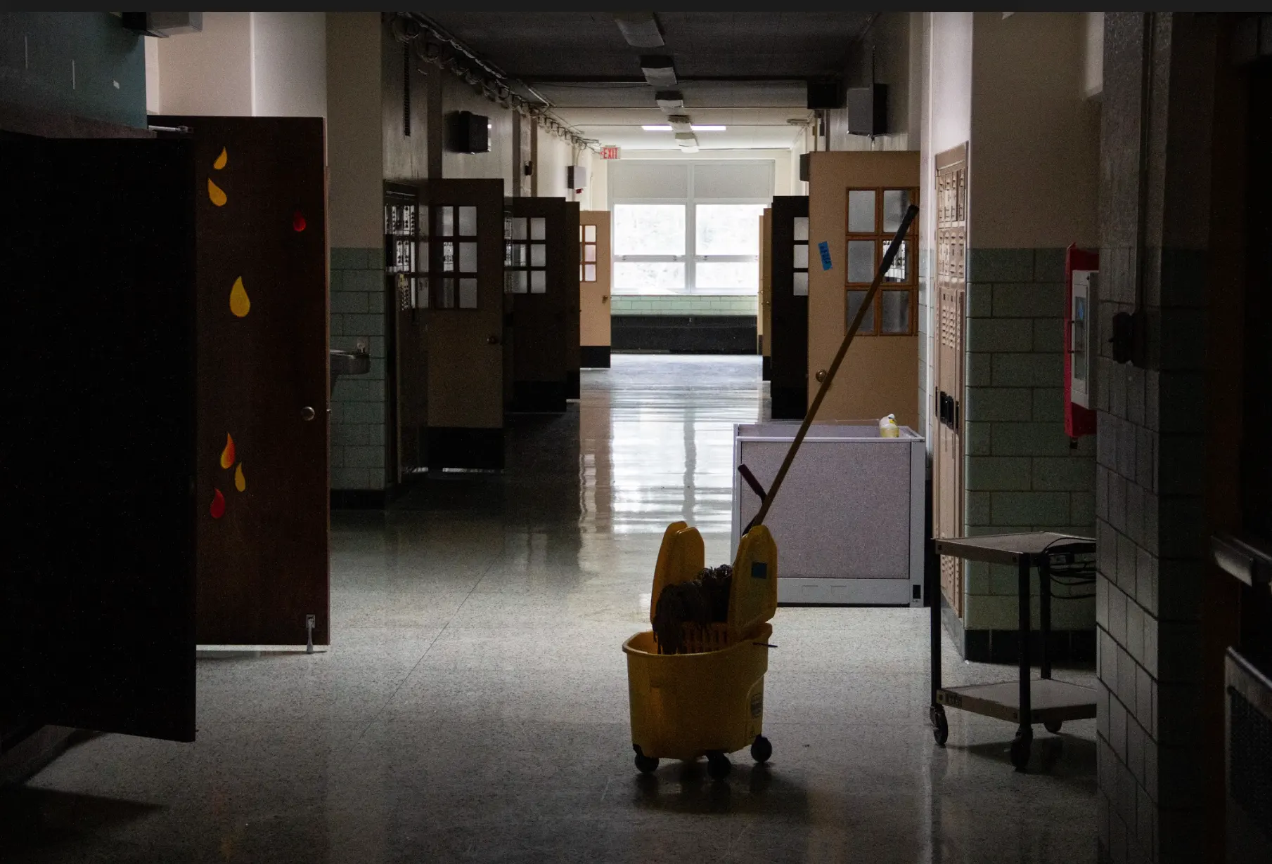 Interior space of 125 royal ave showing old school hallways with janitors bucket and mop