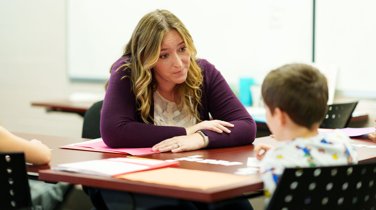 Arcadia student teaching child.