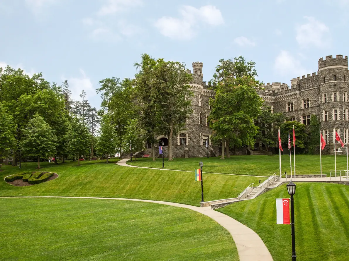 A sweeping view of Arcadia's expansive green lawn with the castle in the background.