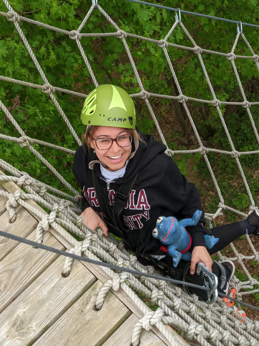 student on high ropes