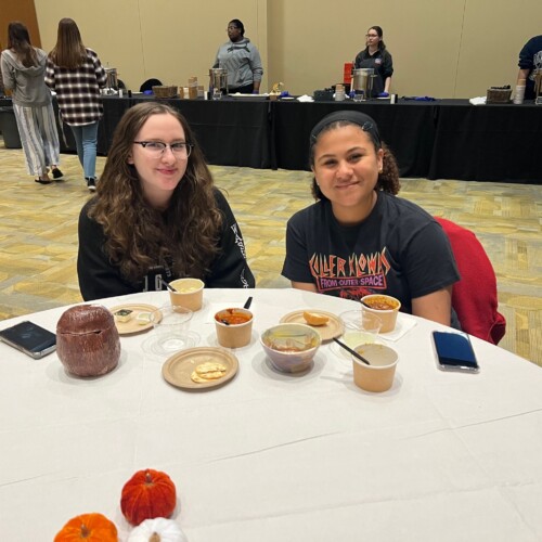 People enjoying their soup at the Empty Dinner Bowl Event.