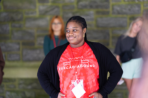 A student wears an Arcadia bound t-shirt.