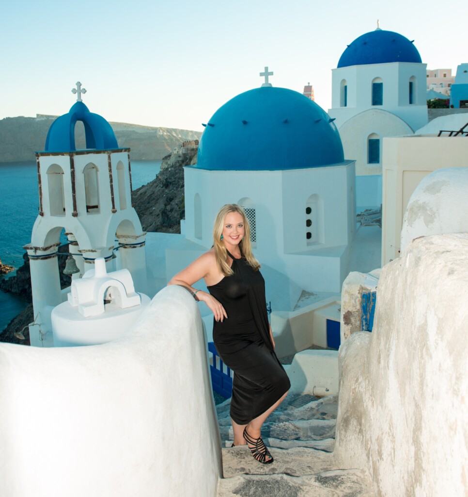 A person posing on steep Greek steps