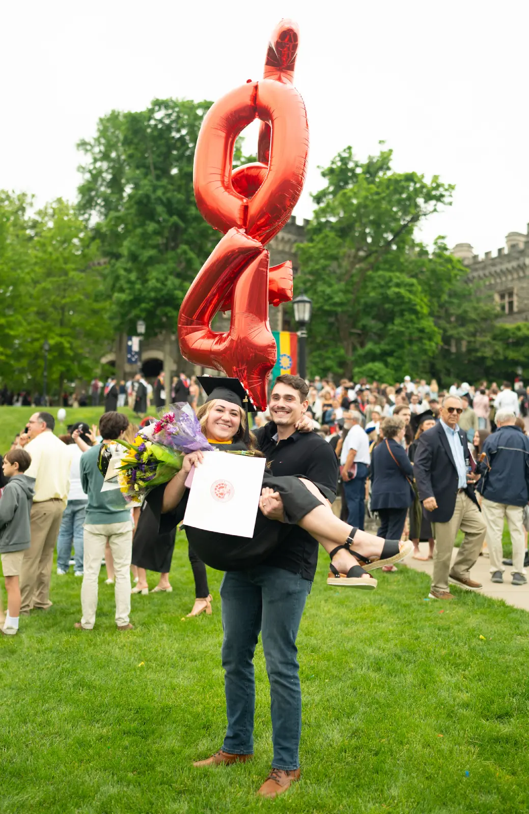 A graduate celebrating.