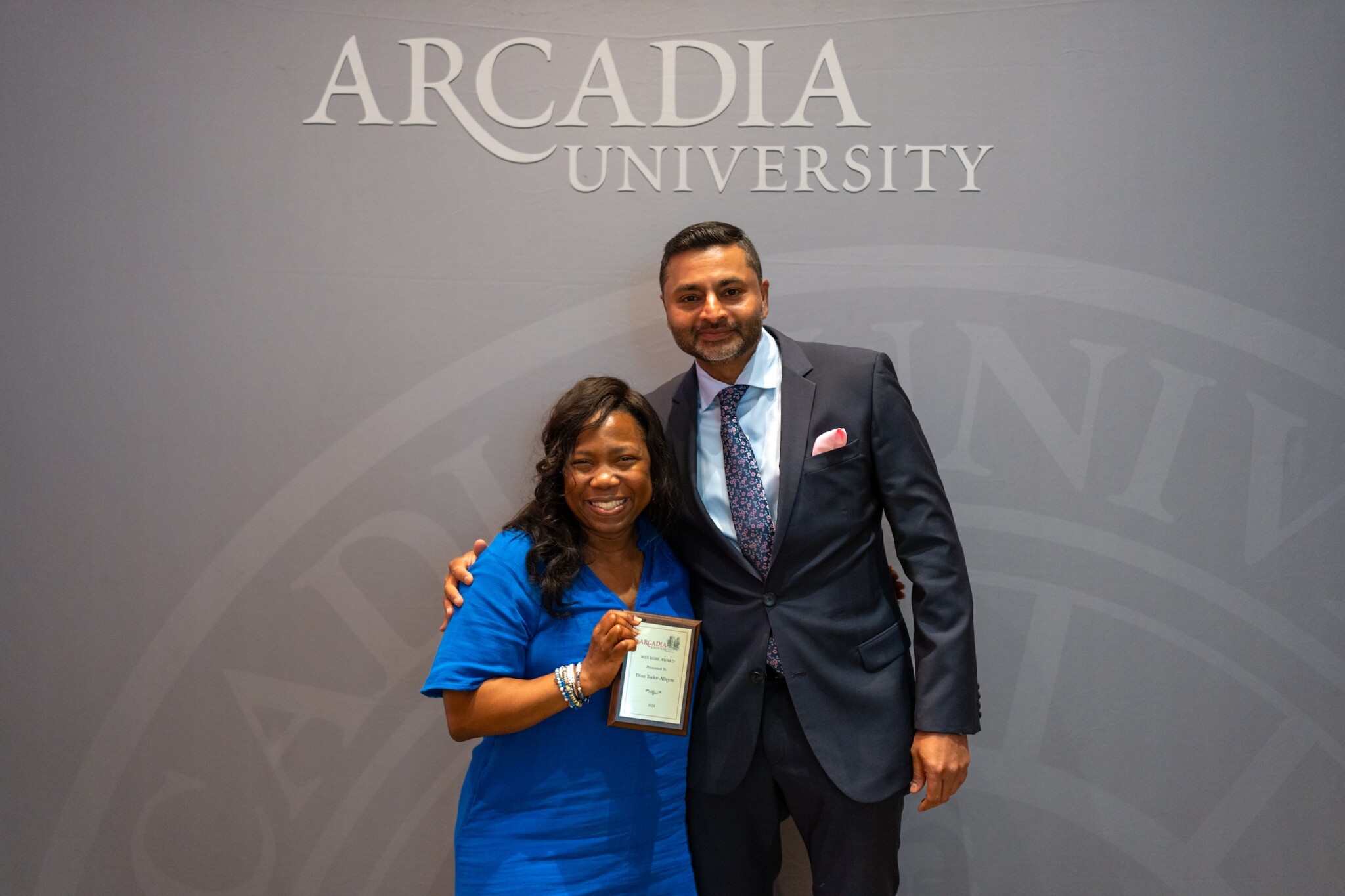 Dian Taylor-Alleyne holds the Wes Rose Access and Inclusion Award and stands with President Ajay Nair