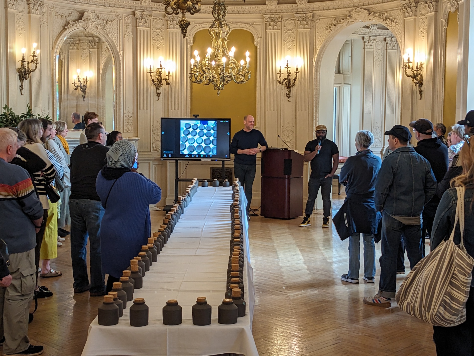 Chef Omar Tate addresses the audience at the ˈȯi-stər · ve-səl pickled oyster tasting