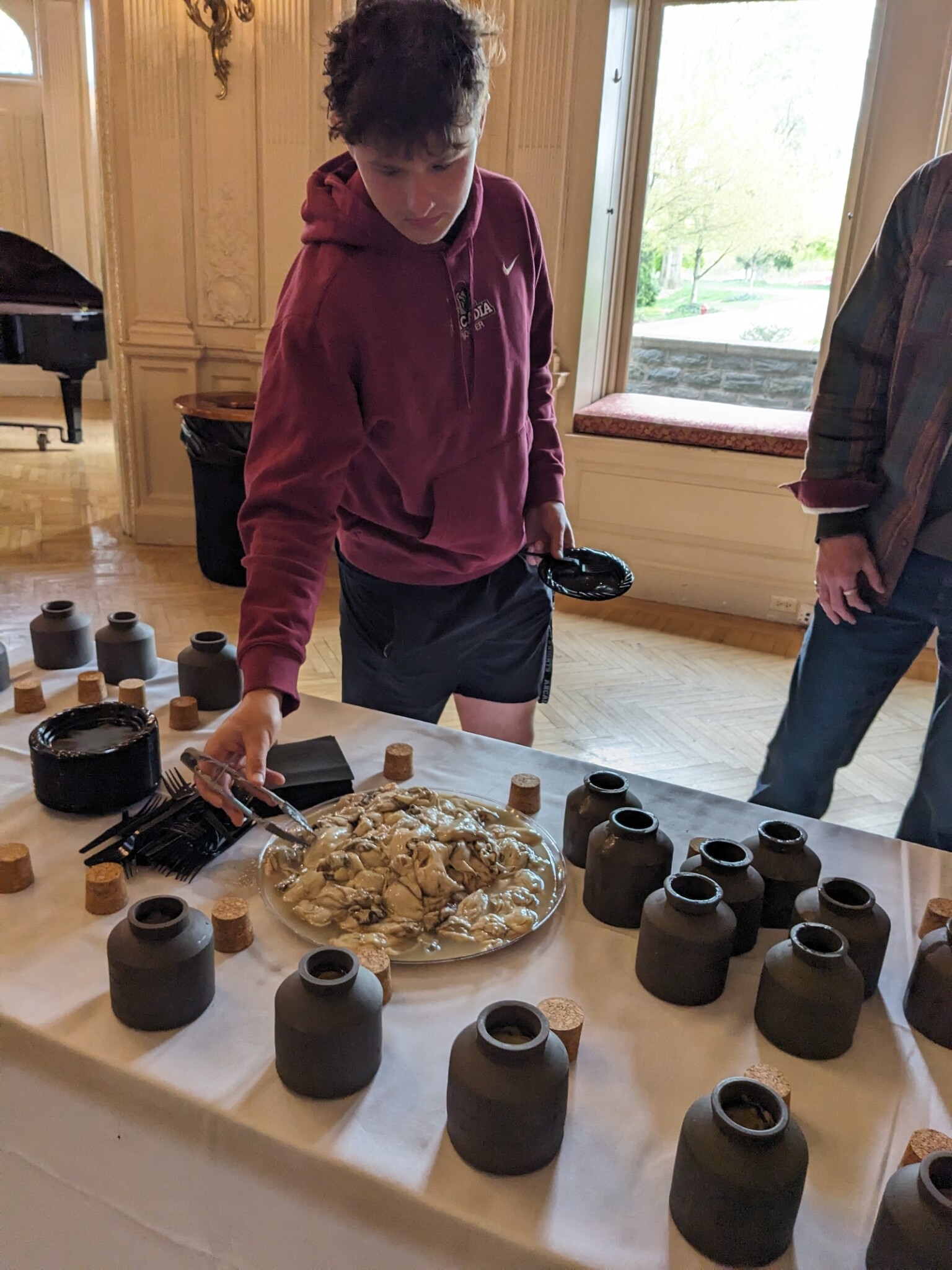 An Arcadia student chooses an oyster at the ˈȯi-stər · ve-səl pickled oyster tasting