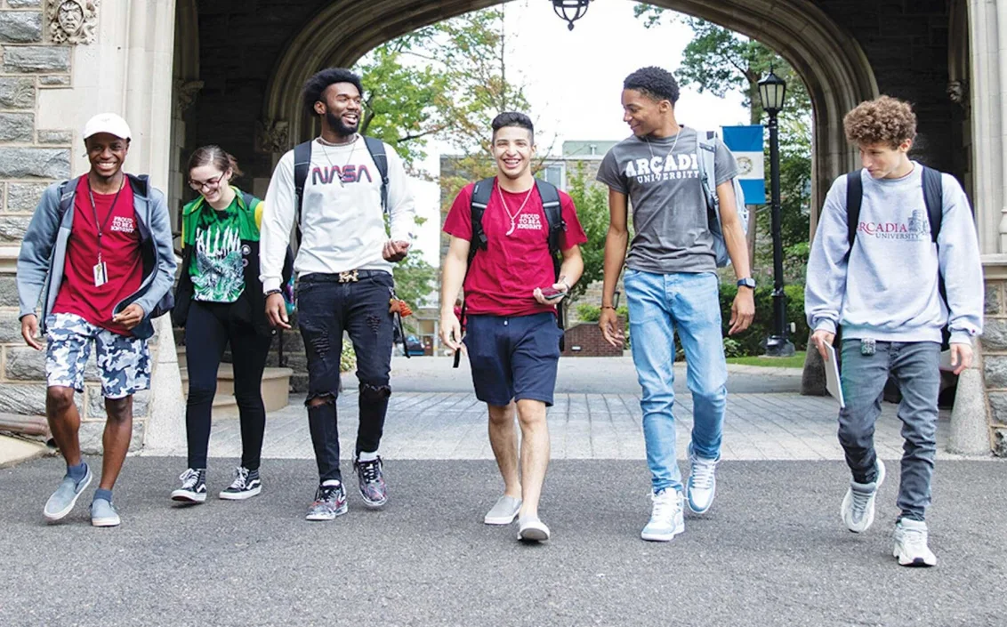 six Arcadia students of color are walking together on campus