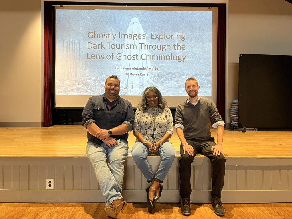 Three faculty members posing during an event for CASAA