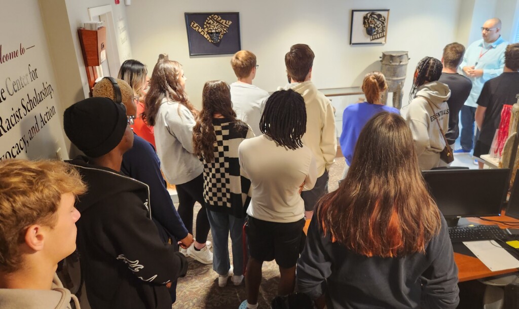 Students taking a tour of a cultural exhibition