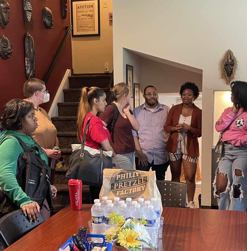 Students taking a tour of the CASAA house