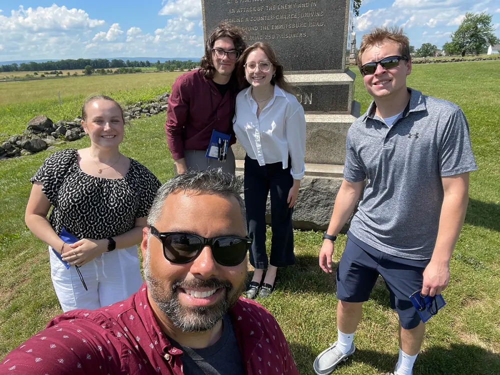 Dr. Favian Martín with four Criminal Justice majors at the NEACJS conference.