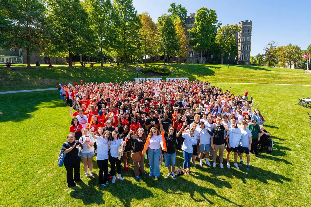 Class of 2028 smiling into the camera on Haber Green