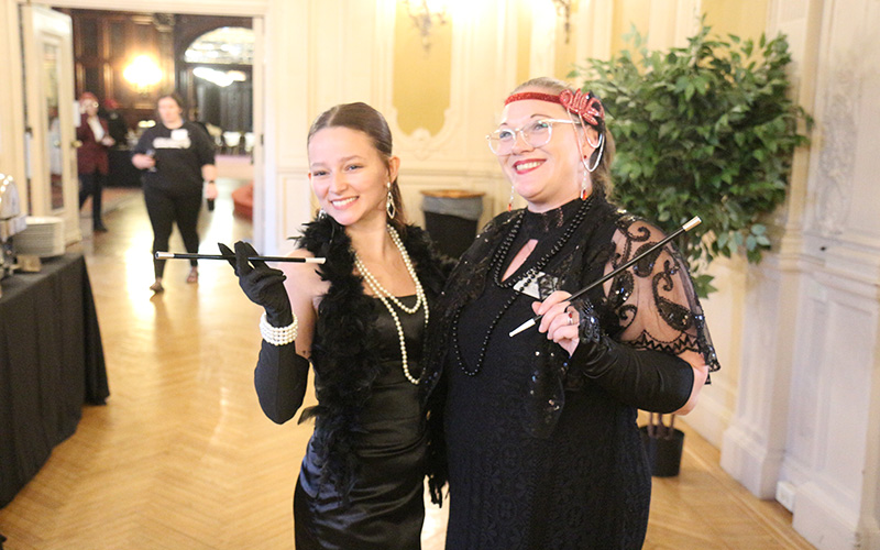 Two women enjoy the Murder Mystery Dinner.