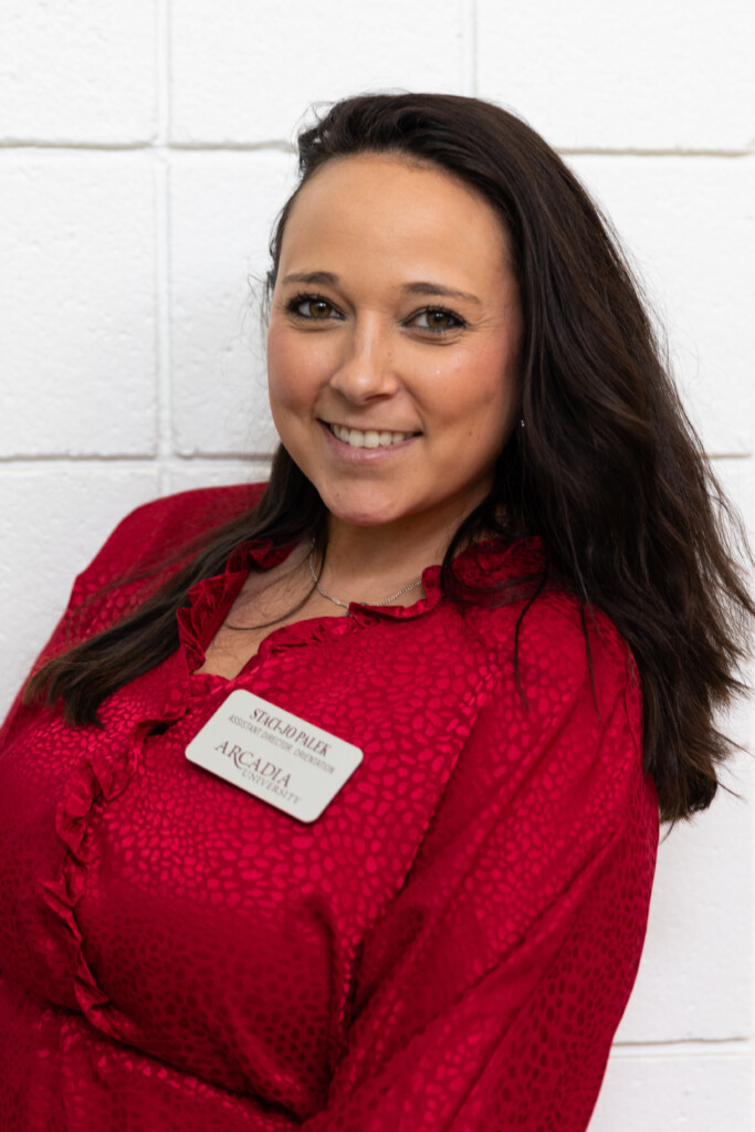 Staci Jo Palek Assistant Director of Student Engagement at Arcadia University smiles on campus.