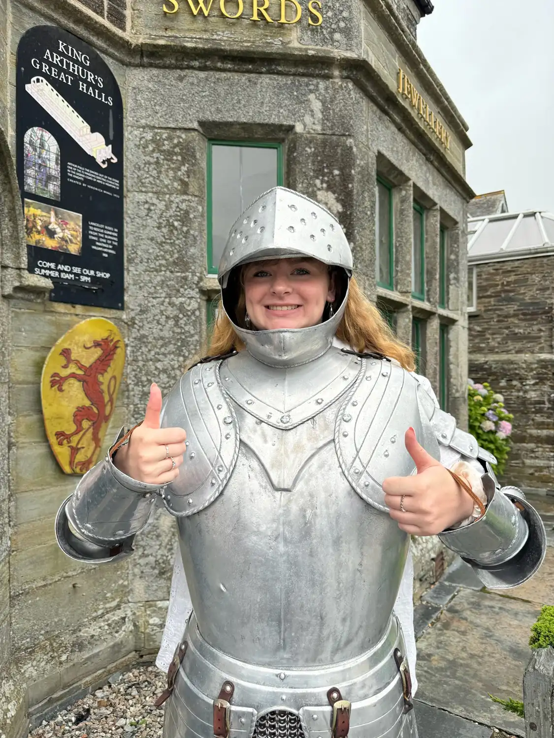 Kylee Kramer giving a thumbs up while dressed in a suit of armor.