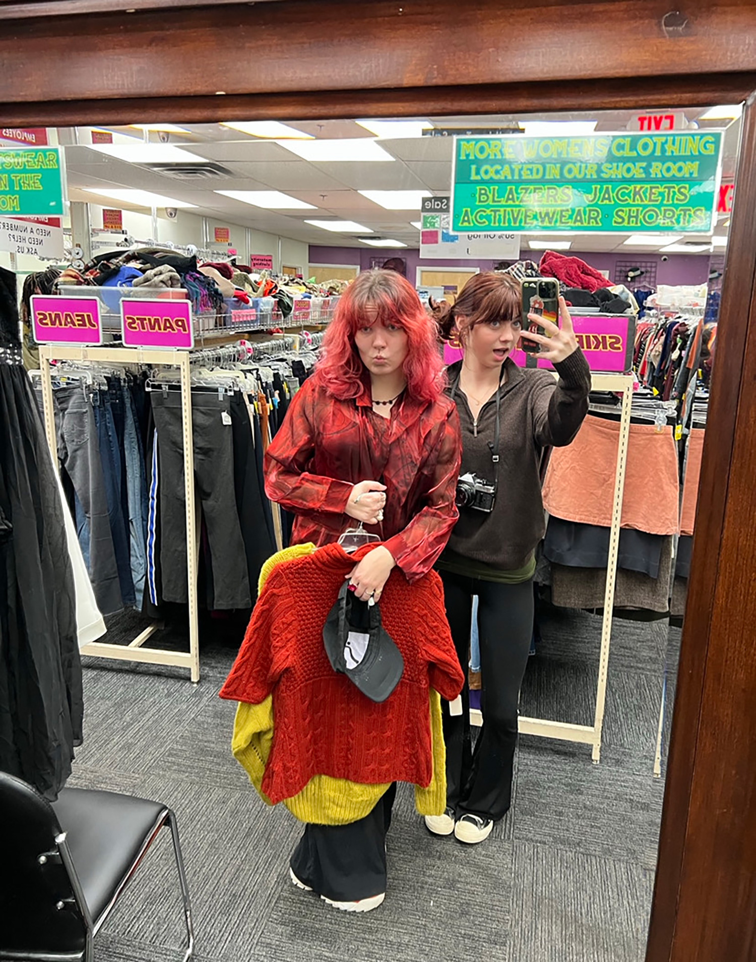 Zara Peters and her friend in the New Life thrift store.