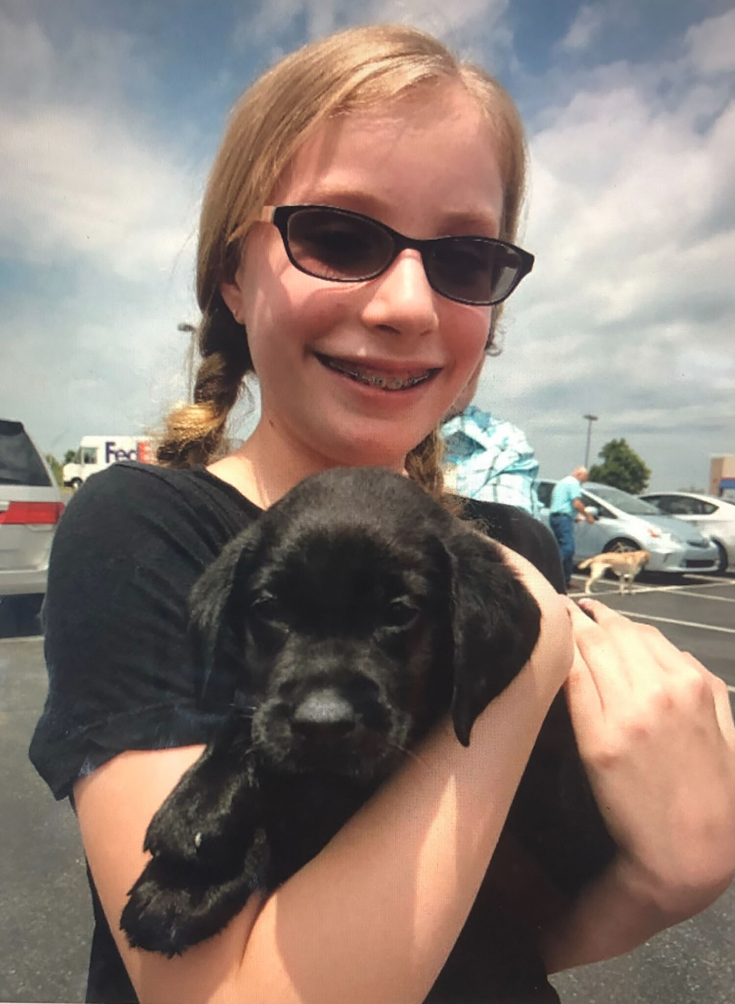 Roberti and her first puppy, O'Shea