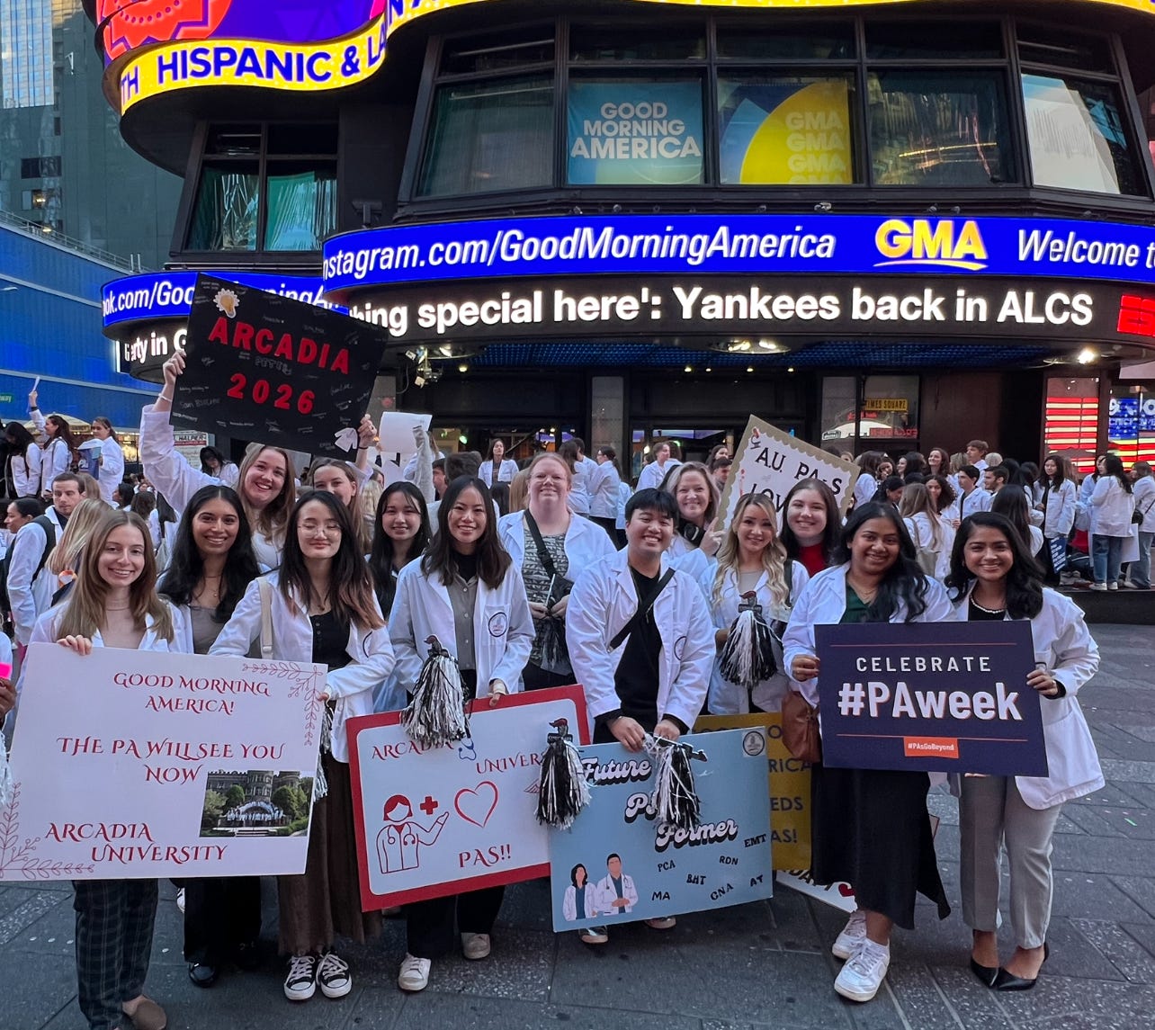 A group of PA students from the Class of 2026 pose for a photo on Rockefeller Plaza in front of the Good Morning America studio