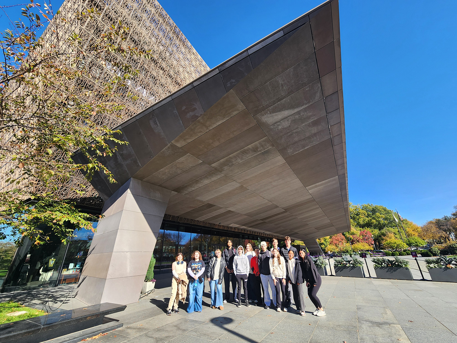 Prof. McCreery's FYS class standing outside of a museum.