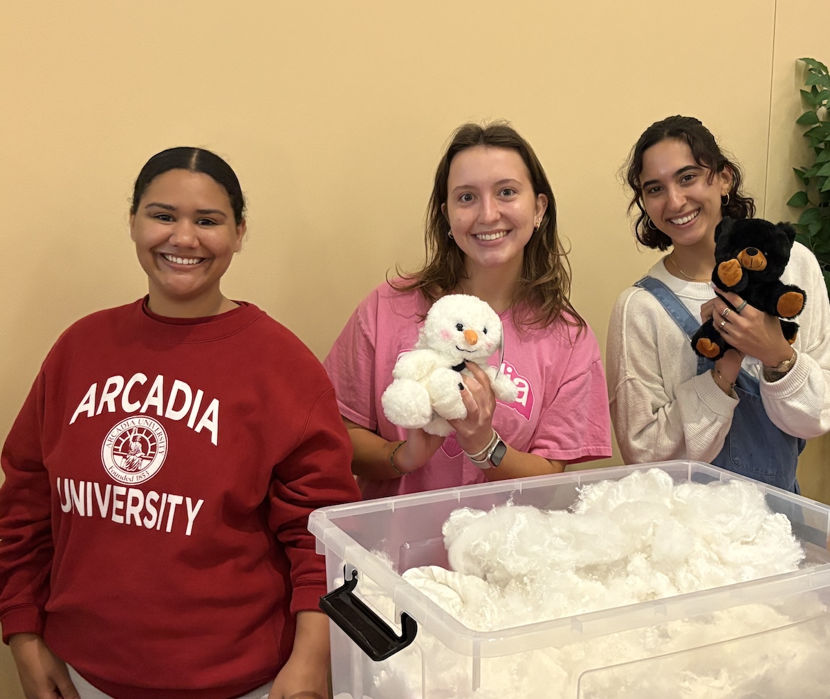 students hold stuffed animals