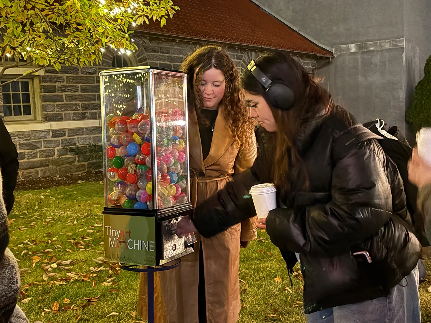 A student getting an item from the Tiny Art Machine at Get Lit.