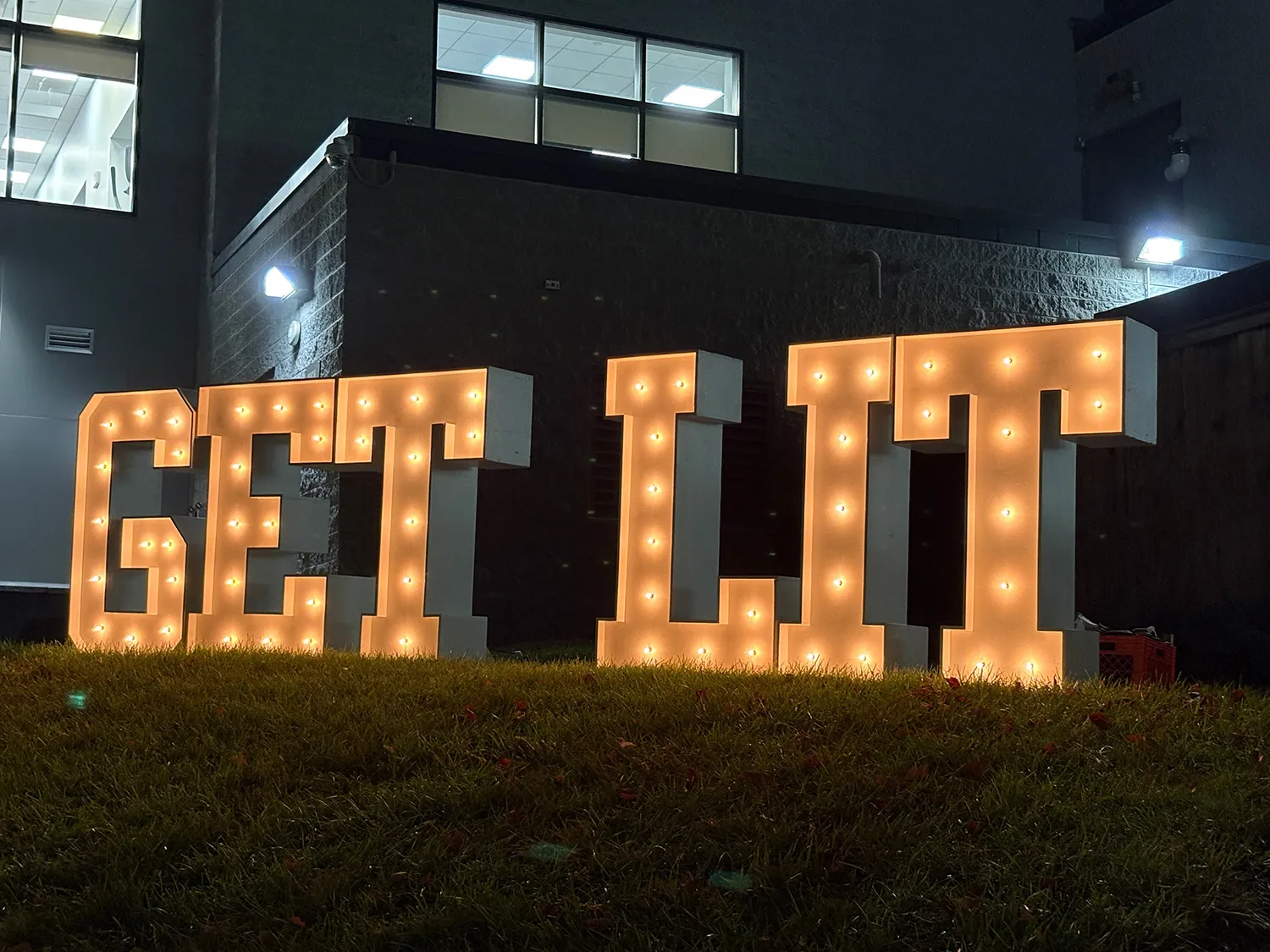 Lit up letters reading "Get Lit" next to the Kuch Center.