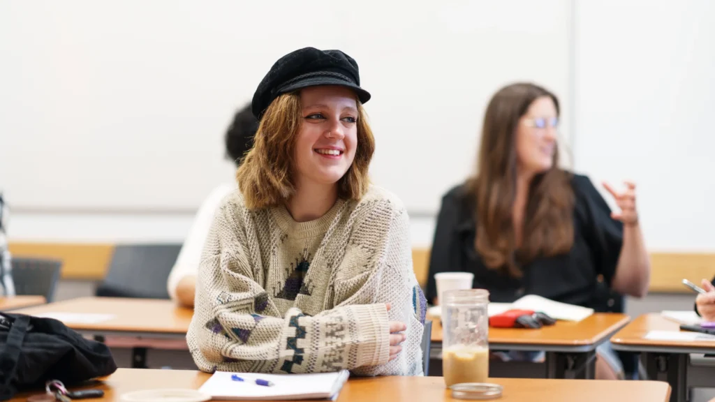 A student listens to a Creative Writing lecture.