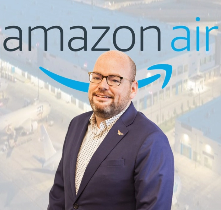 A headshot of Kevin Hughes '07 with the logo for Amazon Air in the background.