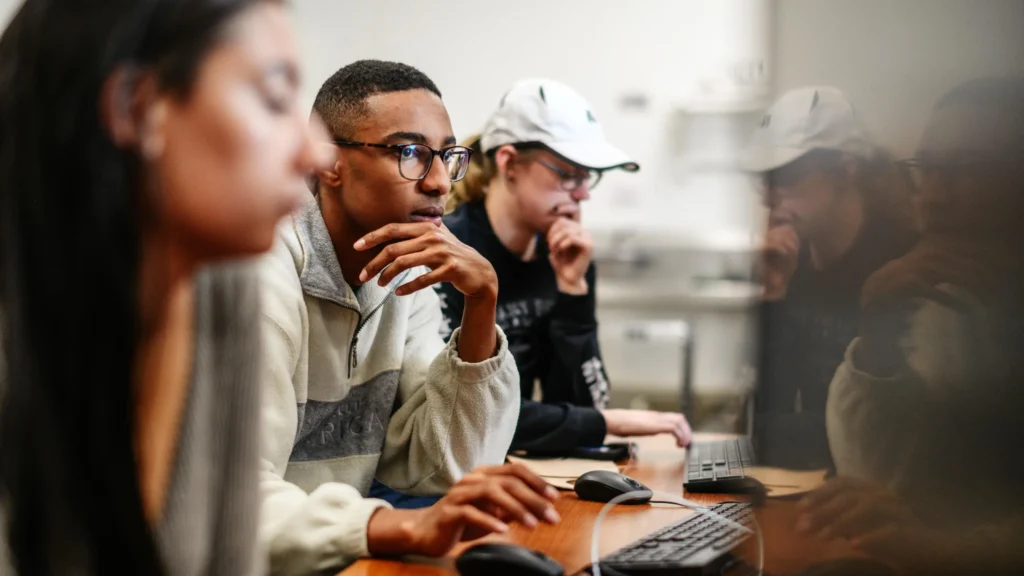 Public Relations students work on their computers in class.