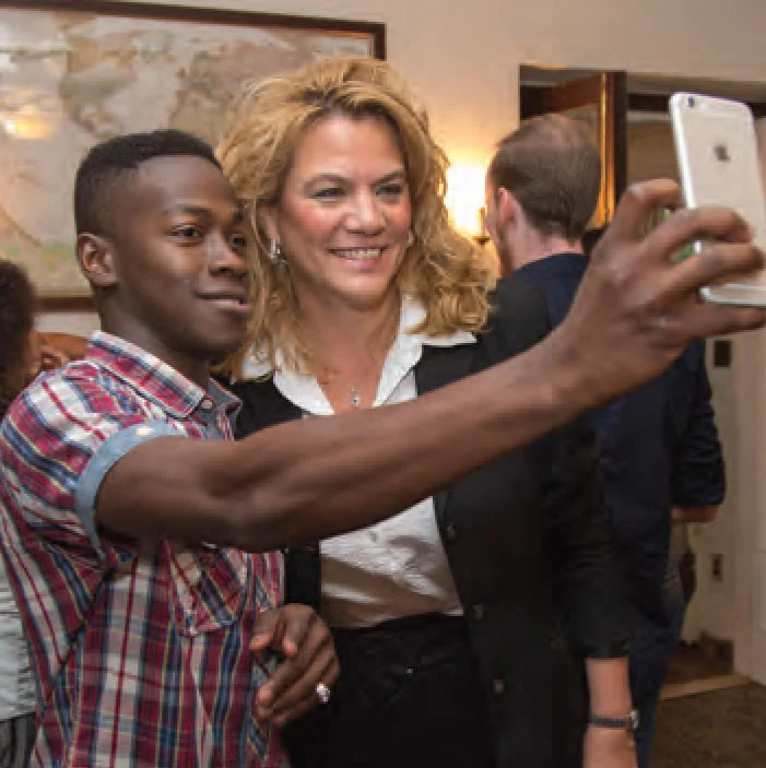 Mutaz Barnawi, an international graduate student from Saudi Arabia, takes a selfie with President DeVille Christensen during the Office of International Affairs welcome picnic.