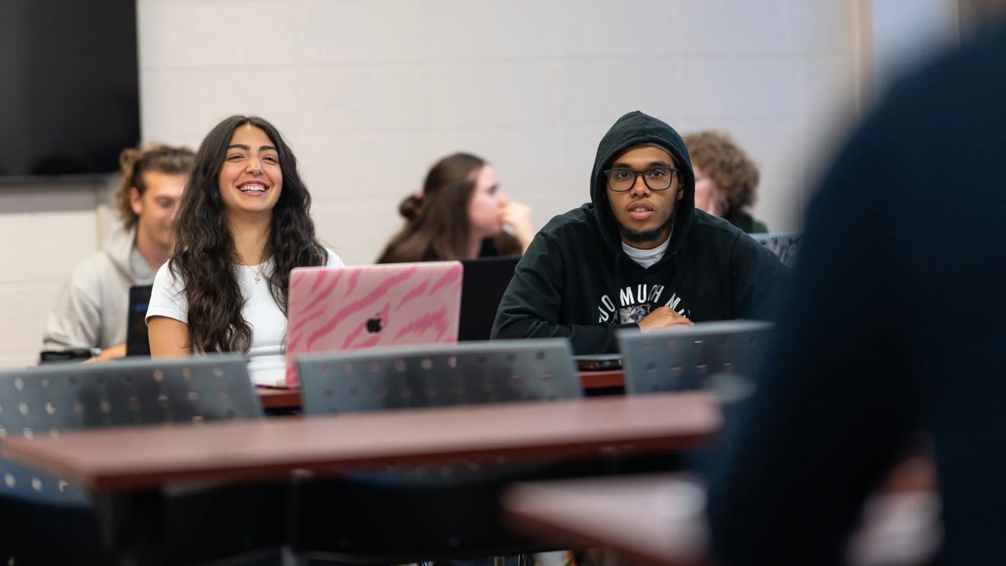 Education students smile during class.